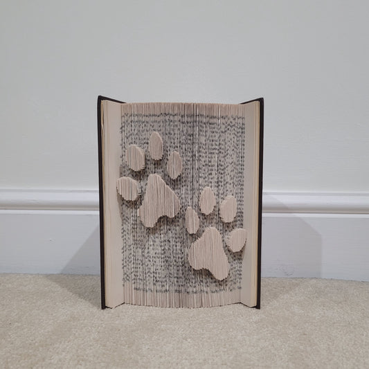 A book fold with two paw prints on the front.