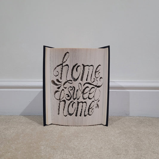 A book fold with the words "Home Sweet Home" on the front.