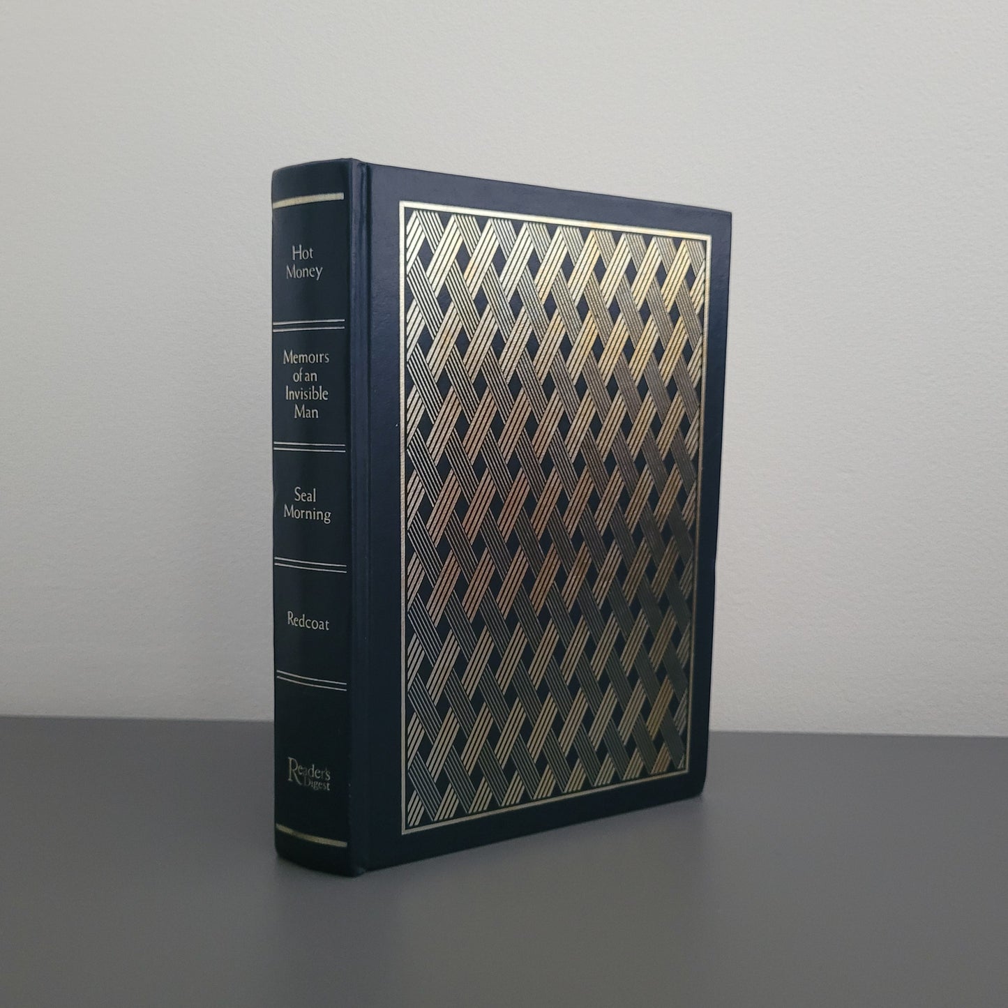 The front of the book fold - a blue hardback book with a shiny pattern on the cover.