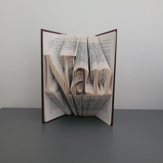 A picture of a book fold with the word "Nan" on the front.