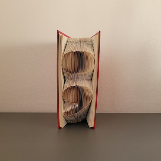 A book fold with a semi colon on the front.