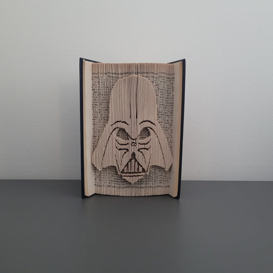 A folded book with Darth Vader on the front.