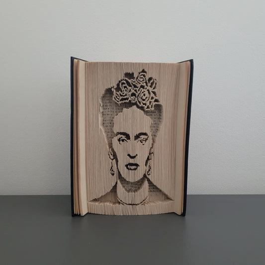 A book fold with a picture of Frida Kahlo on the front.