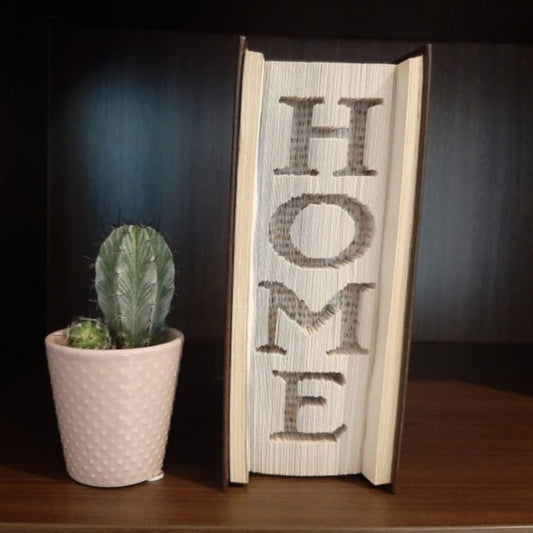 A book fold with the word "Home" vertically down on the front.
