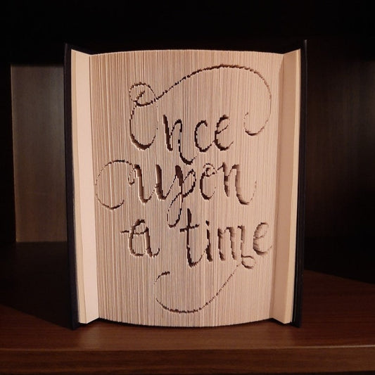 A picture of a book fold with the words "Once Upon A Time" on the front.
