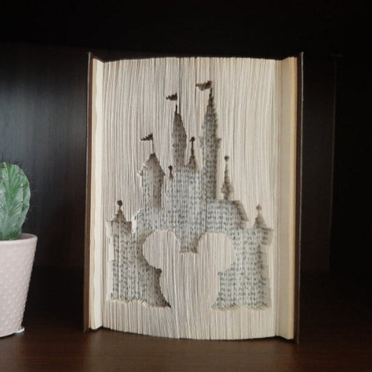 A book fold with the disney castle on the front.